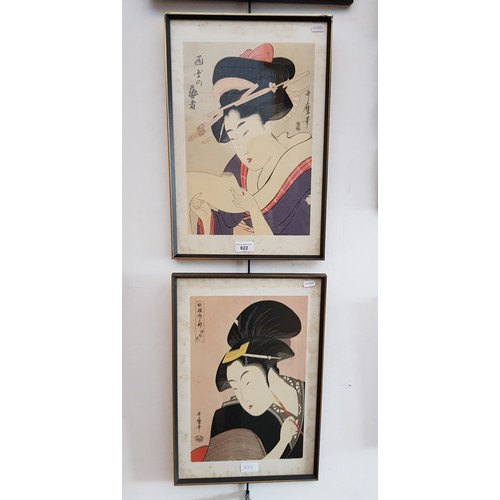 822 - A pair of Japanese prints after Kitagawa Utamaro (1753-1806), both framed and glazed, 32cm x 47cm ov... 