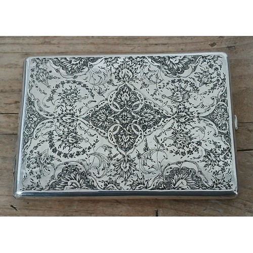 225 - An Iranian silver cigarette case, 11cm x 8cm, weight 5ozt.