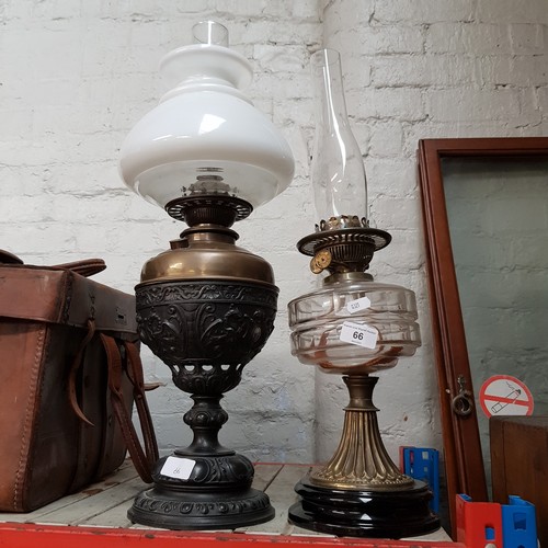 66 - 2 paraffin lamps, one with shade and both with funnels