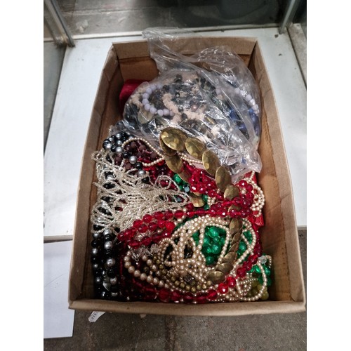 743 - A box of assorted costume jewellery