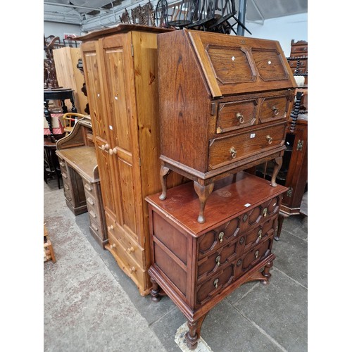 960 - An oak bureau with matching side cabinet and a pine wardrobe.