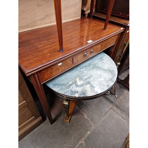 968 - A George III mahogany fold top tea table together with a continental composite top and gilt metal mo... 