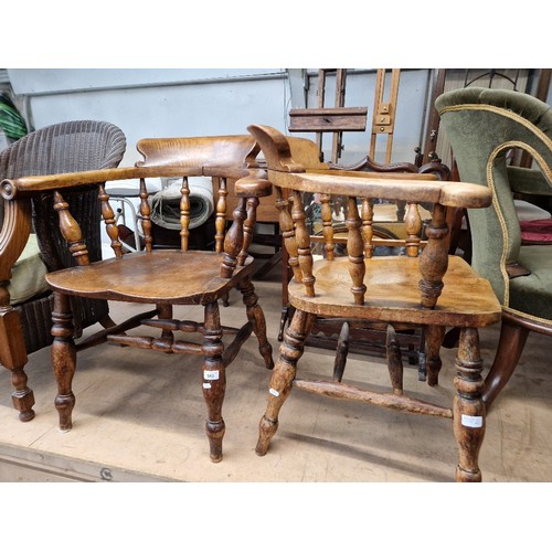 982 - A pair of beech and elm captain's chairs.