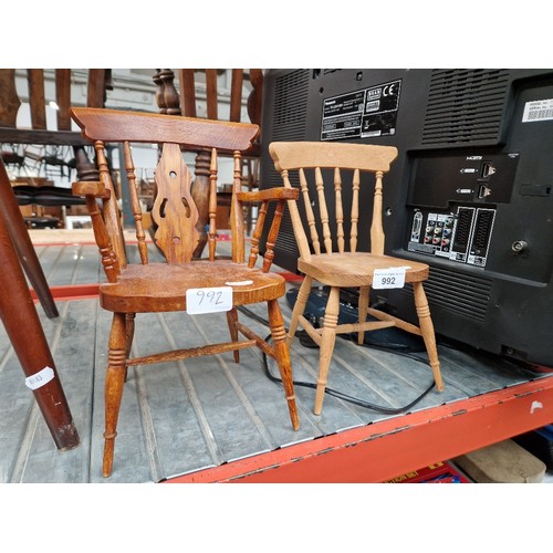 992 - Two miniature oak country style chairs.