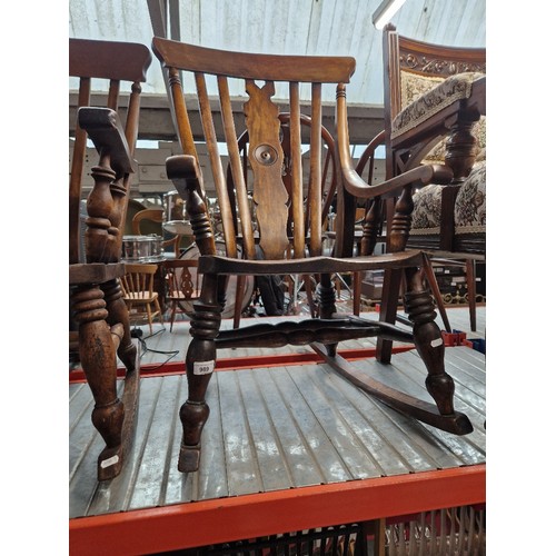 989 - A 19th century beech country rocking chair.