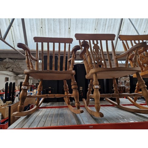 986 - A pair of beech country style rocking chairs.