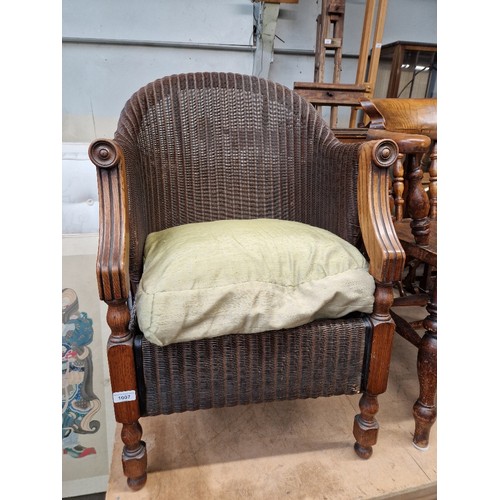 1007 - A Lloyd Loom armchair.