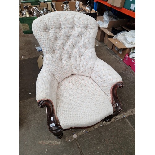 998 - A Victorian mahogany framed button back armchair.