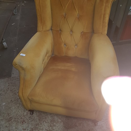 1001 - A pair of Victorian Chesterfield wingback armchairs.