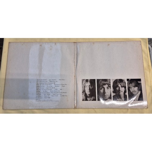 304 - A mixed box to include pictures, video camera, 45s and LPs including Beatles White Album