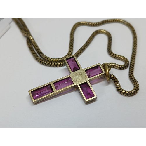 113 - A Victorian garnet and split pearl cross pendant, length 34mm, on 38cm smooth snake link chain, both... 