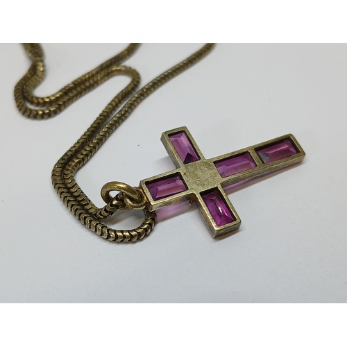 113 - A Victorian garnet and split pearl cross pendant, length 34mm, on 38cm smooth snake link chain, both... 