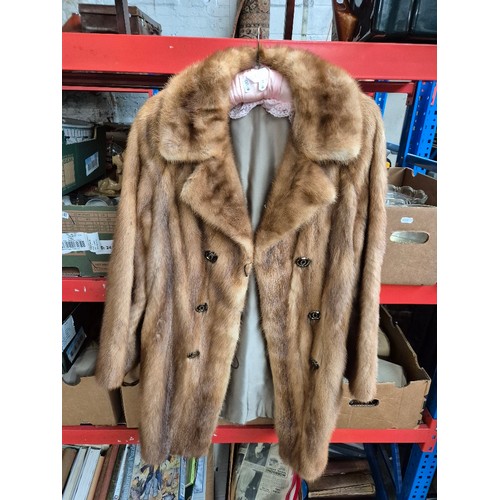 125 - Five fur coats and a faux fur including  white mink, red fox, pale mink (x2).