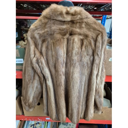 125 - Five fur coats and a faux fur including  white mink, red fox, pale mink (x2).