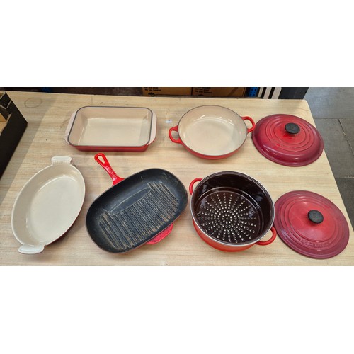 97 - A box of Le Creuset cook wares including 2 lidded casseroles, skillet, and 2 baking dishes