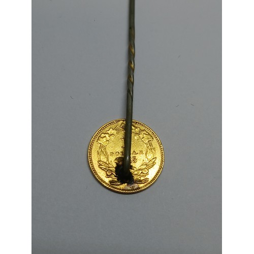 398 - A 19th century USA one dollar gold coin soldered on a stick pin.