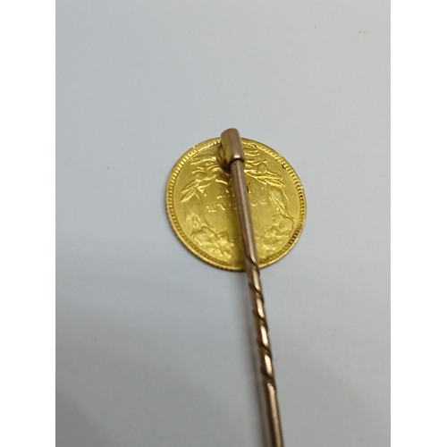 399 - An 1857 USA one dollar gold coin soldered on a stick pin.