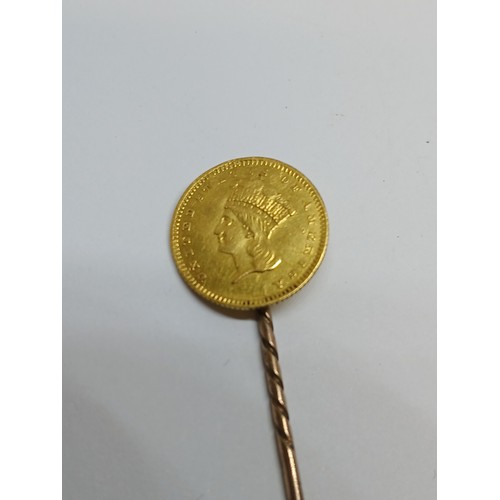 399 - An 1857 USA one dollar gold coin soldered on a stick pin.