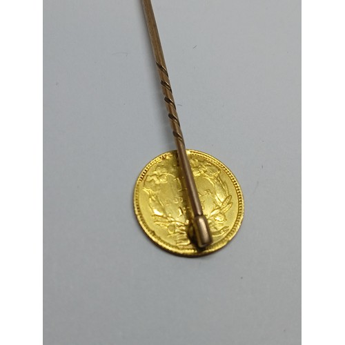 399 - An 1857 USA one dollar gold coin soldered on a stick pin.