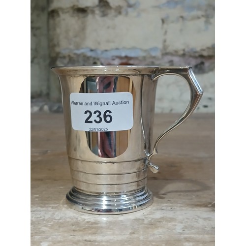 236 - A hallmarked silver tankard, height 8cm, weight 3.6ozt.