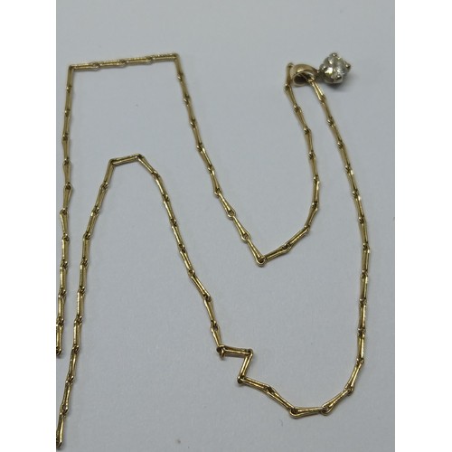108 - A single stone diamond pendant on chain, the round brilliant cut stone weighing approximately 0.16ct... 