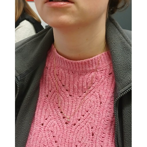 108 - A single stone diamond pendant on chain, the round brilliant cut stone weighing approximately 0.16ct... 