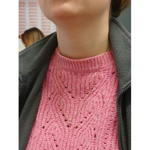 108 - A single stone diamond pendant on chain, the round brilliant cut stone weighing approximately 0.16ct... 