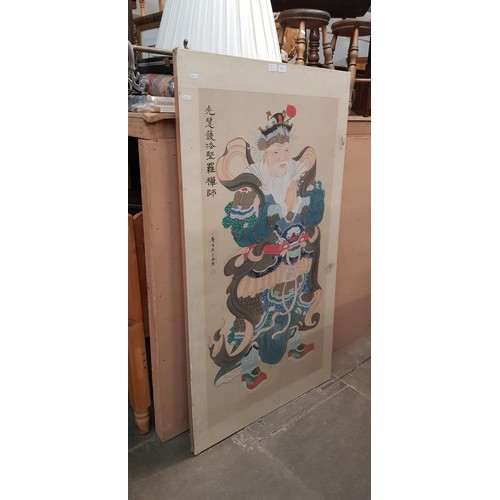 811 - A series of three Japanese paintings on silk depicting deities, 81.5cm x 149cm each (overall).  NOT ... 