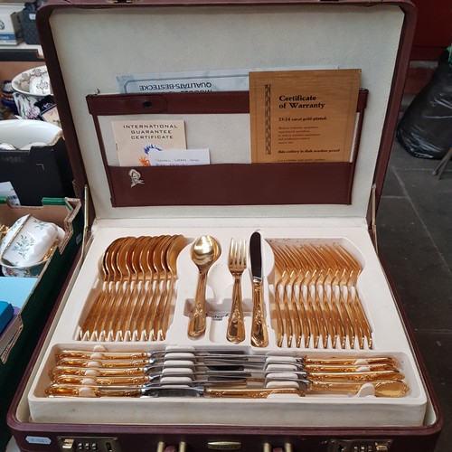 686 - A canteen of gold plated cutlery.