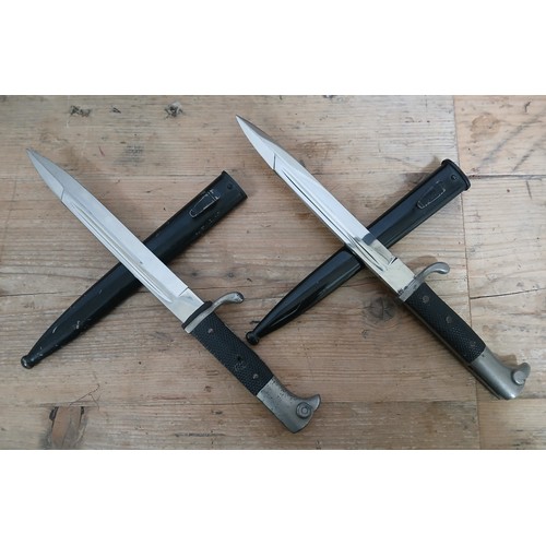 13 - Two German Third Reich K98 Parade bayonets by Carl Eickhorn, blade length 19cm, textured black bakel... 