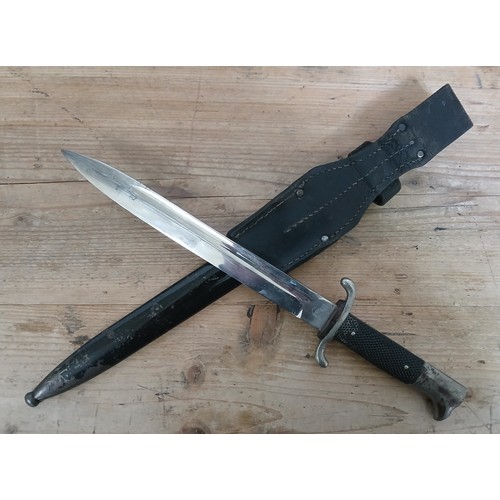 20 - A German Third Reich Fireman's Parade dagger by Geco, blade length 24.5cm, metal scabbard and leathe... 