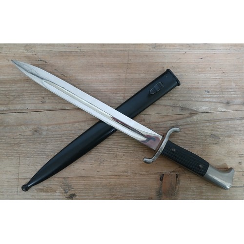 23 - A German Third Reich Fireman's Parade dagger, blade length 24.5cm, metal scabbard and associated lea... 