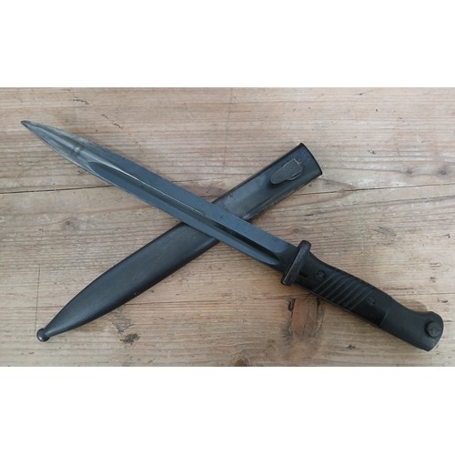 27 - A German Third Reich K98 bayonet, blade length 24.5cm, wooden grip, metal scabbard, total length 40.... 