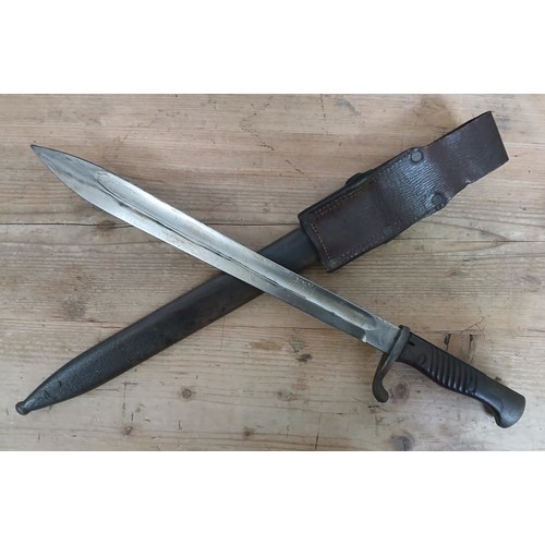 32 - An Imperial German 1898/05 pattern bayonet by AC, blade length 37cm, wooden grip, metal scabbard and... 