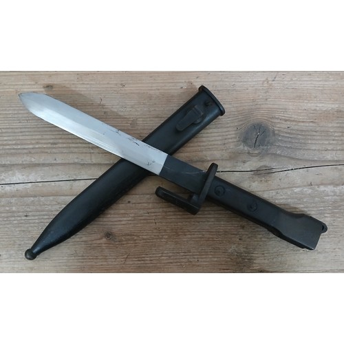 37 - A British X2E1 Trials bayonet, blade length 18cm, metal scabbard, wooden grip, total length 34cm.