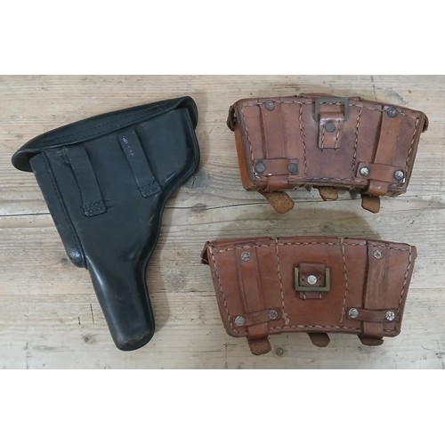 48 - A German WWII era black leather Luger Holster and ammunition pouches.