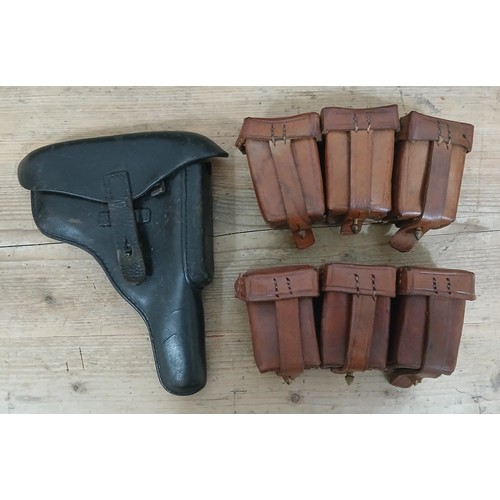 48 - A German WWII era black leather Luger Holster and ammunition pouches.