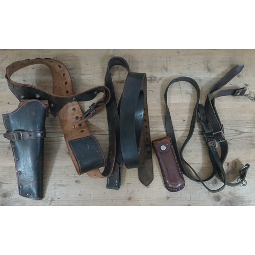 49 - Assorted WWII era and later leather including a gun holster and cartridge belt, two belt straps, a s... 