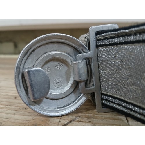 51 - A post war SS Officer's parade belt and buckle, the cast aluminium buckle marked RZM SS and AOHGV, t... 