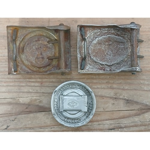 75 - A German Third Reich RAD Officer's belt buckle and two post war buckles.