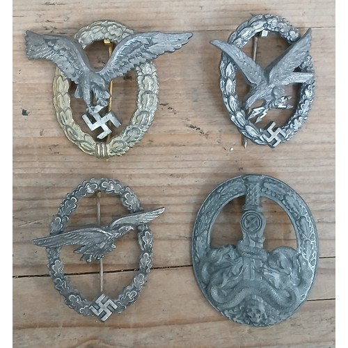 82 - A group of four post war German badges.