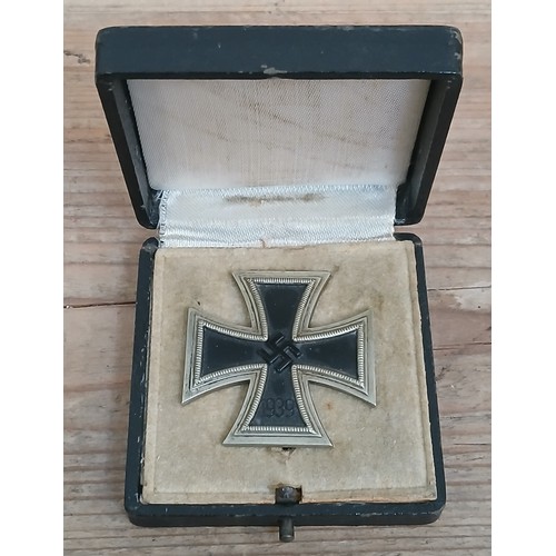 85 - A German Third Reich First Class Iron Cross, marked 595, with associated box.