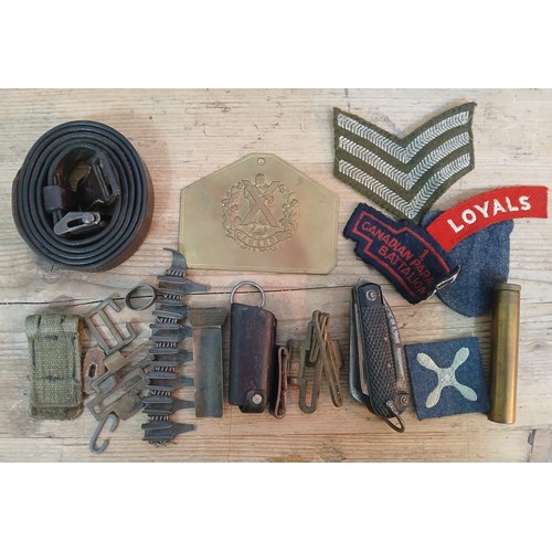 96 - Assorted military including a British military pen knife cloth badges, belt, Cameron badge etc.