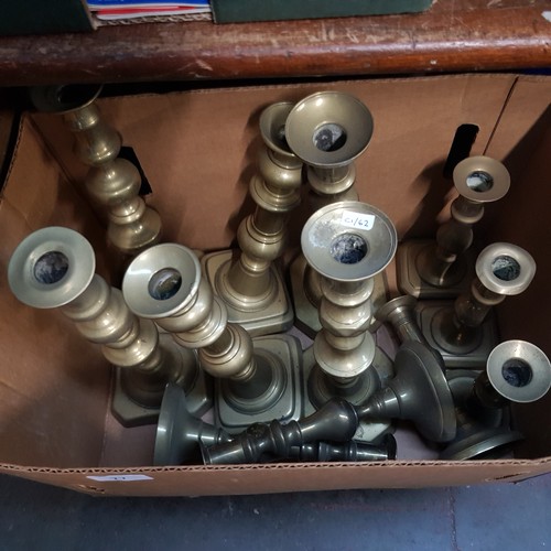 77 - 6 pairs of old brass candlesticks