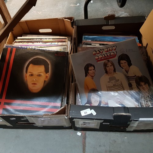 85 - Two boxes of vinyl LP records, pop, jazz, country, etc, including Bay City Rollers signed by all the... 