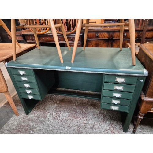 1009 - An industrial style green painted steel desk.