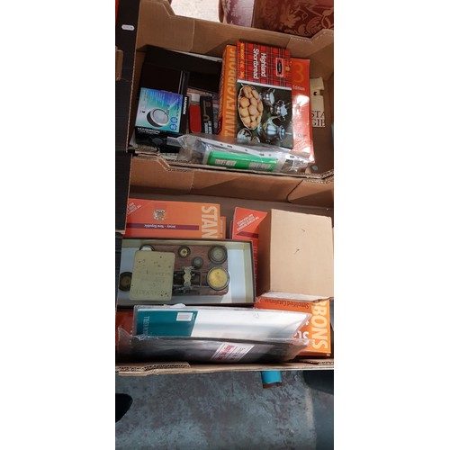 387 - Two boxes of stamp collecting items including postage scales, Stanley Gibbon stamp catalogues, acces... 