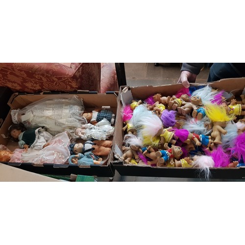 386 - A box of trolls and a box of vintage dolls.