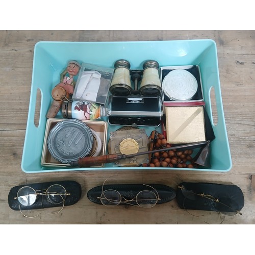 225 - A tray of assorted collectables including three pairs of gold plated spectacles.