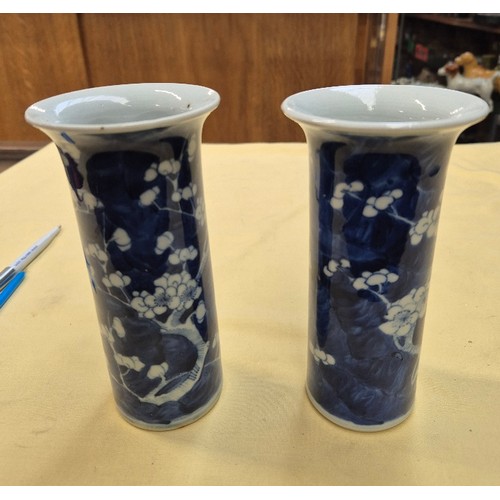 454 - A pair of Chinese blue and white sleeve vases, bearing four character Kangxi marks, height 15cm.